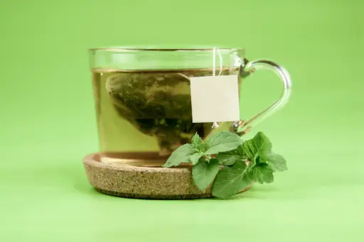 Green Tea By Wooden Spoon 